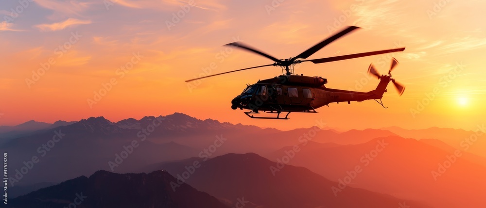 Helicopter flies over mountain range at sunset, clouds scatter sky Helicopter flies over mountain range at sunset, clouds scatter sky