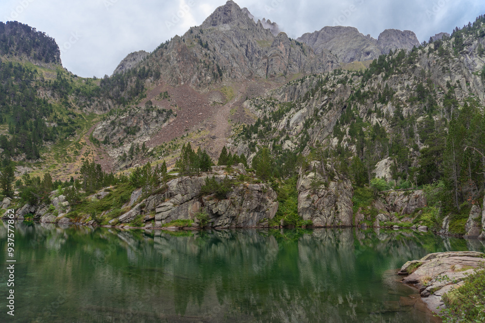 Beautiful lake in the forest at autumn day, Pirineos, Huesca (Spain) Beautiful lake in the forest at autumn day, Pirineos, Huesca (Spain)