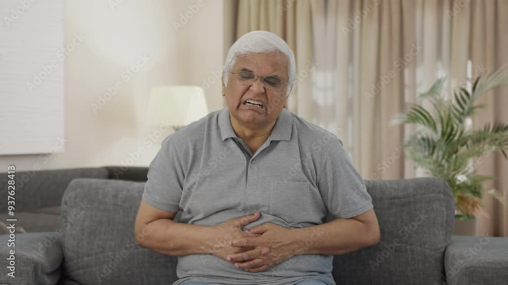 Sick Indian old man suffering from stomach pain Sick Indian old man suffering from stomach pain