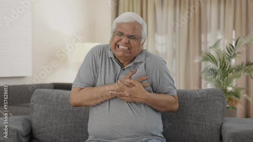 Sick Indian old man having a heart attack