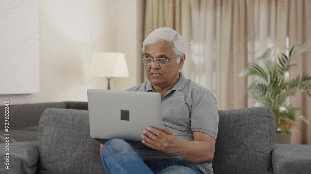 Angry Indian old man shouting on video call on laptop Angry Indian old man shouting on video call on laptop