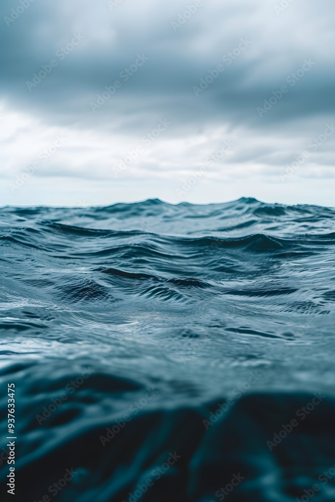 Fototapeta premium Macro shot of the rippling ocean surface under an overcast sky AI generated illustration