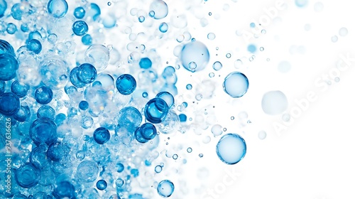 Transparent blue bubbles of different sizes, clustered and scattered across a white backdrop, creating a sense of motion