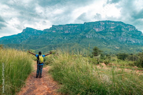 Scenic view of a hiker against a Mountain background at Mount Napak in Karamoja, Uganda
 photo