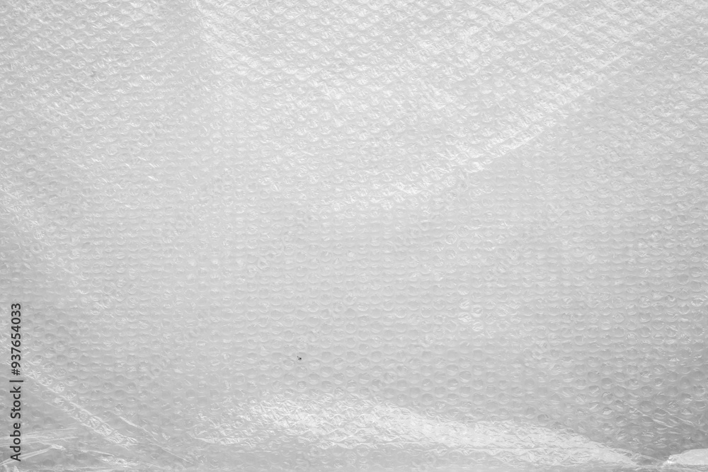A close-up of a wrinkled plastic and foil texture, featuring crumpled patterns and a mix of silver and black hues. The grunge element adds an abstract, reflective quality to the material. A close-up of a wrinkled plastic and foil texture, featuring crumpled patterns and a mix of silver and black hues. The grunge element adds an abstract, reflective quality to the material.