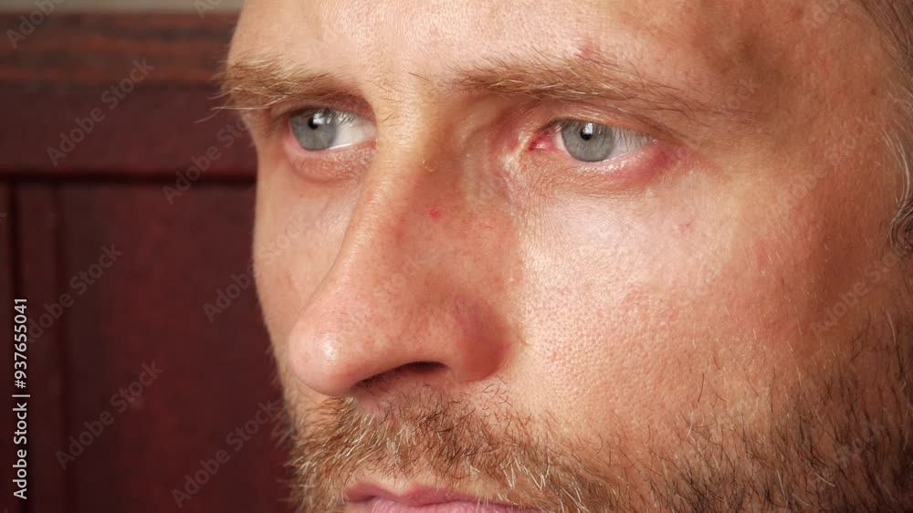 pensive man sits in the corner of his room, lost in his thoughts pensive man sits in the corner of his room, lost in his thoughts