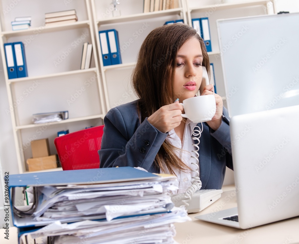Beautiful female employee unhappy with excessive work Beautiful female employee unhappy with excessive work