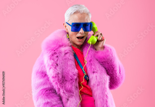 Photography Happy beautiful senior woman with stylish clothing portrait on colorful isolated