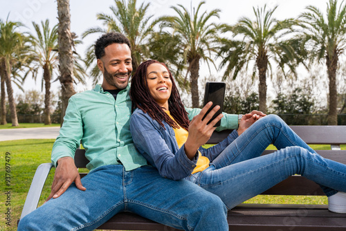 Happy hispanic latino couple dating outdoors - Young happy black couple in love spending time together outdoors