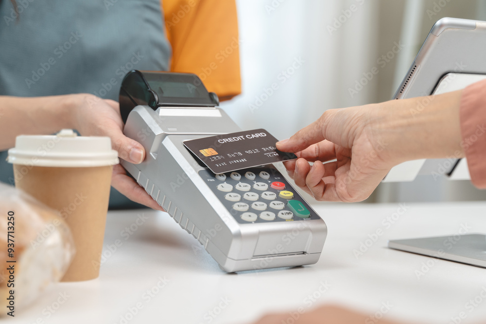 Cashless payment in shopping concept, Close-up hands using mockup credit card pay at cafe. Cashless payment in shopping concept, Close-up hands using mockup credit card pay at cafe.