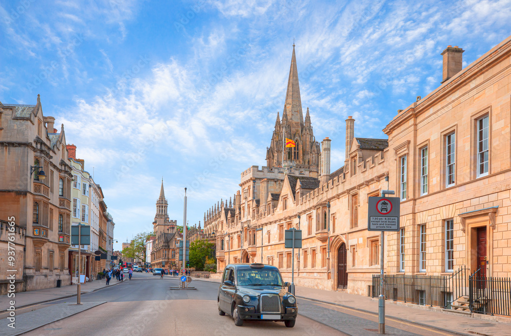 Fototapeta premium View of High Street road with Cityscape of Oxford - Typical black british taxi cab 
