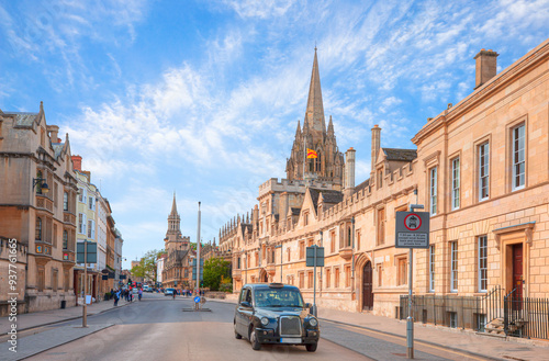 View of High Street road with Cityscape of Oxford - Typical black british taxi cab  photo