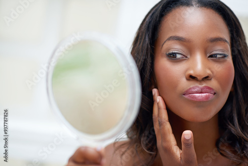 Makeup, beauty and black woman with mirror in home for cosmetics, inspection and check in bathroom. Hand, thinking and female person with reflection in house for morning routine, results and shine