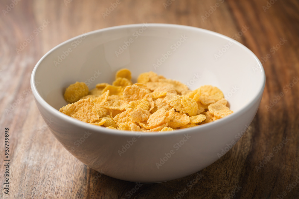 corn flakes in white bowl on table corn flakes in white bowl on table
