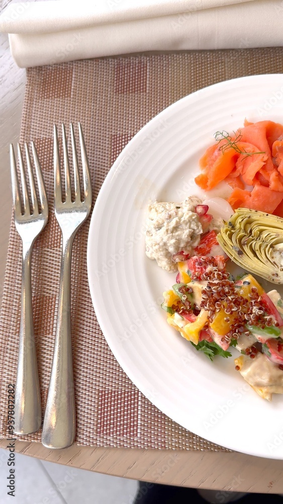 Artichoke, chicken salad, and salmon featured on white plate, emphasizing eco-conscious ingredients. This sophisticated hotel lunch combines sustainable indulgence with gourmet flavors. Artichoke, chicken salad, and salmon featured on white plate, emphasizing eco-conscious ingredients. This sophisticated hotel lunch combines sustainable indulgence with gourmet flavors.