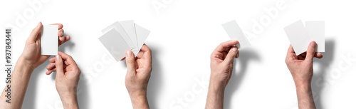 Two hands display blank cards in varying configurations, suggesting a brainstorming session or game preparation while set against a stark white backdrop photo