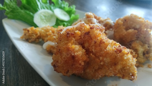 Crispy Fried Chicken with Fresh Salad Garnish