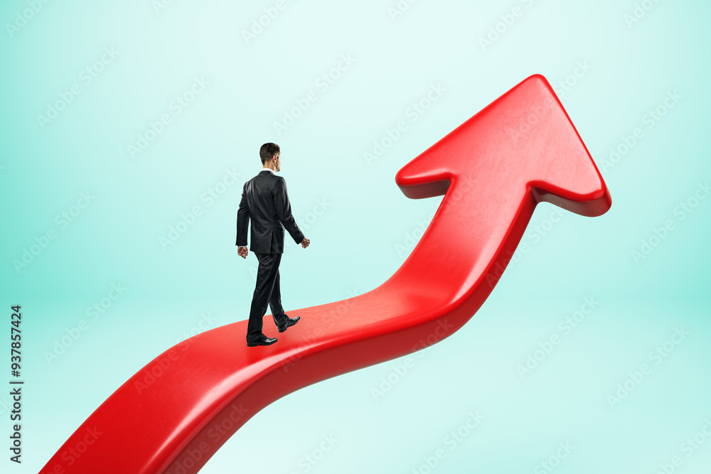 Fototapeta premium Businessman walking on a large red arrow pointing upward, symbolizing growth and success.