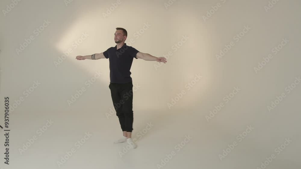 A person is dancing gracefully in a sophisticated and minimalist studio environment A person is dancing gracefully in a sophisticated and minimalist studio environment