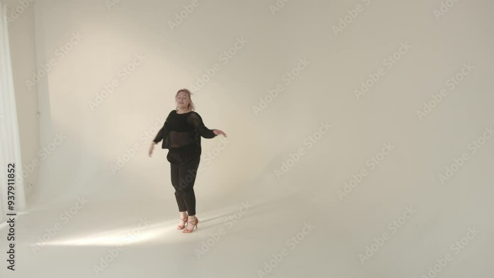 A Confident Model Posing Gracefully in a Stylish, Minimalist Studio Exuding Elegance A Confident Model Posing Gracefully in a Stylish, Minimalist Studio Exuding Elegance