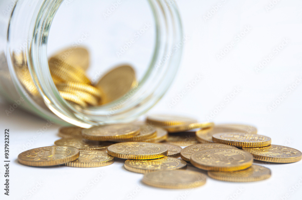 Golden coins and jar background with customizable space for text or ideas. Wealth and copy space concept. Golden coins and jar background with customizable space for text or ideas. Wealth and copy space concept.