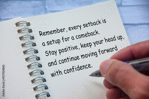 Motivational and inspirational or encouragement quote relating setback and comeback written on notepad. Inspirational and encouragement concept photo