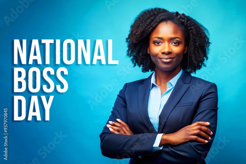 Happy National Boss Day! A Confident Businesswoman Stands With Arms Crossed. photo