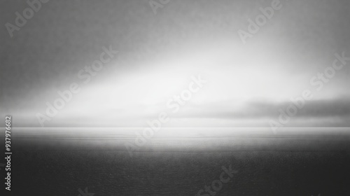 Minimalist grayscale horizon with soft light creating a serene and abstract landscape