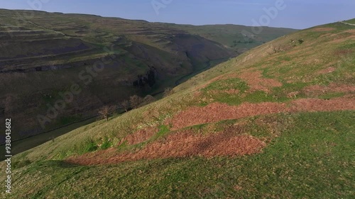 Aerial footage which emphasizes the river's journey as it carves its way through Arncliffe, highlighting the natural contrasts and beauty	 photo