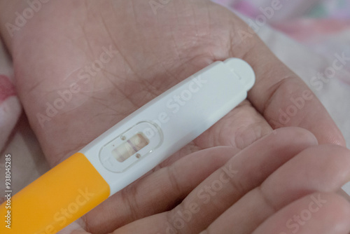 Close up pregnancy test pack hold by hand's woman.