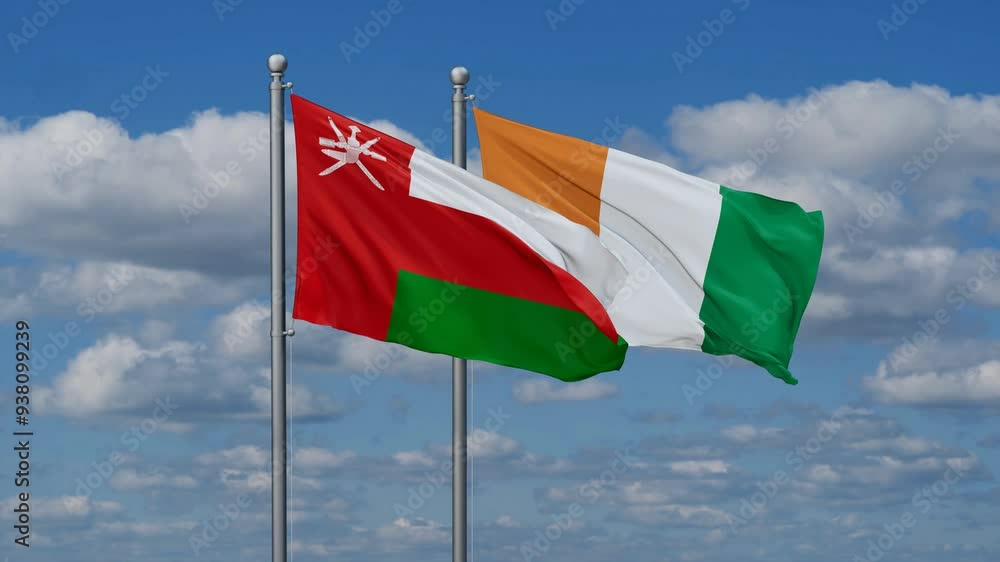 Ivory Coast or Cote d'Ivoire and Oman flags flying together, video concept of the relationship, two country cooperation concept Ivory Coast or Cote d'Ivoire and Oman flags flying together, video concept of the relationship, two country cooperation concept