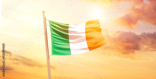 Ireland national flag waving in sunny sky. Ireland national flag for independence day. photo