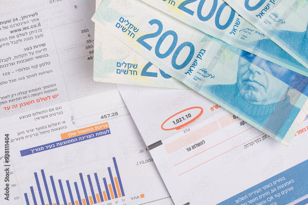Rishon Lezion, Israel – 24.08.2024. Electricity company Hevrat Hashmal and Municipality tax Arnona Invoice. Rising prices, economic crisis in Israel shekels. Written in Hebrew: months and prices. Rishon Lezion, Israel – 24.08.2024. Electricity company Hevrat Hashmal and Municipality tax Arnona Invoice. Rising prices, economic crisis in Israel shekels. Written in Hebrew: months and prices.