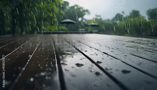 Rain falling on wooden deck in a lush garden during a quiet afternoon in the countryside