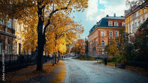 A scenic view of a European city in autumn, featuring historic buildings and streets lined with colorful trees. The vibrant atmosphere captures the rich culture and beauty of the fall season.