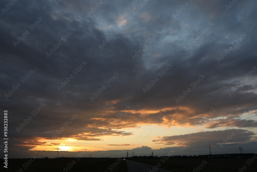 Beautiful cloudy sky over highway on sunset Beautiful cloudy sky over highway on sunset