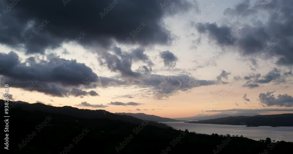 Arenal Lake view at sunset with beautiful clouds and rain forest, near La Fortuna, Costa Rica, Central America Arenal Lake view at sunset with beautiful clouds and rain forest, near La Fortuna, Costa Rica, Central America