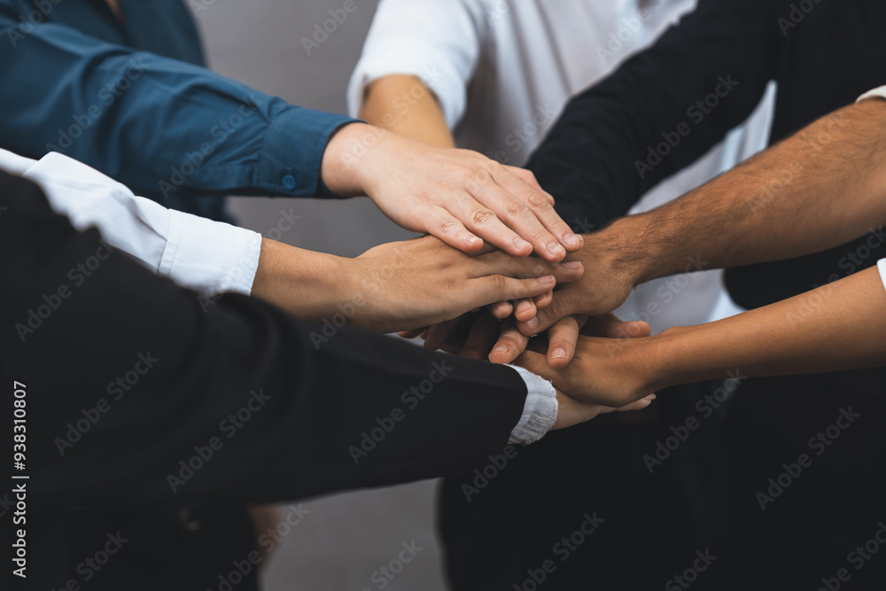 Group of diverse office worker join hand together in office room symbolize business synergy and strong productive teamwork in workplace. Cooperation and unity between business employee. Prudent Group of diverse office worker join hand together in office room symbolize business synergy and strong productive teamwork in workplace. Cooperation and unity between business employee. Prudent