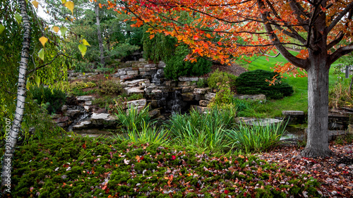 Water falls at Frederik Meijer's garden in Grand Rapids, Michigan in autumn time. photo