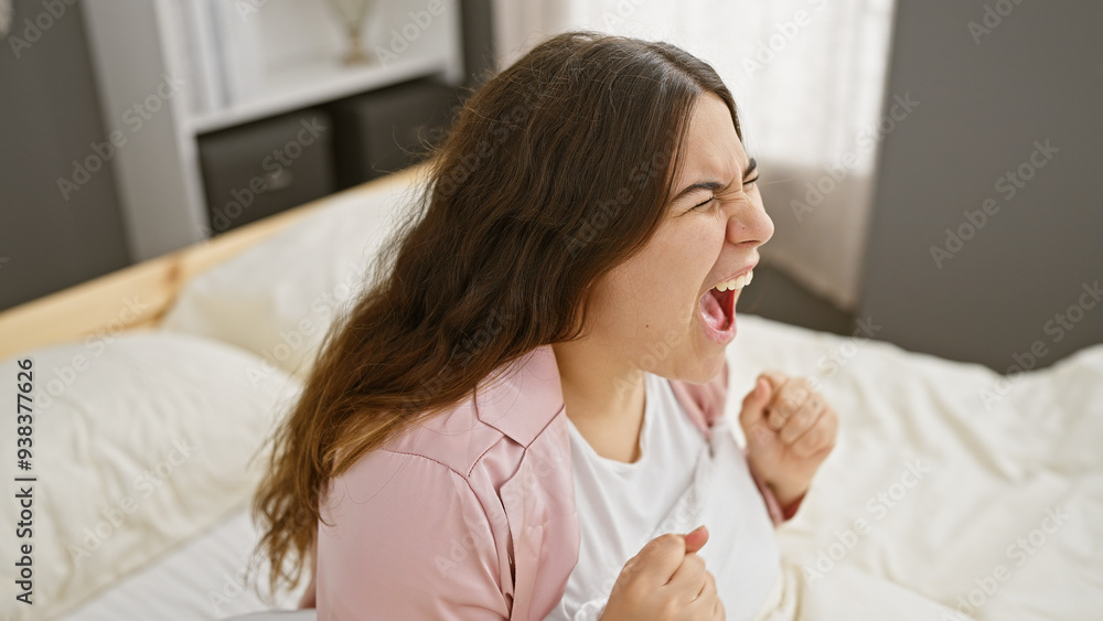 A young hispanic woman expressing excitement in a bedroom setting, embodying beauty and youth indoors. A young hispanic woman expressing excitement in a bedroom setting, embodying beauty and youth indoors.