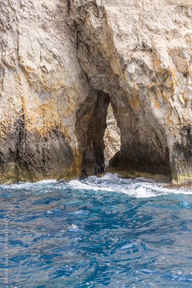 Malta, Blue Grotto. Blue waters of the Mediterranean seen from a tour boat. Malta, Blue Grotto. Blue waters of the Mediterranean seen from a tour boat.