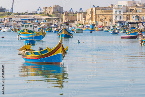 Malta, Marsaxlokk. Marsaxlokk harbor. Luzzijiet, plural of luzzu, colorful traditional Maltese fishing boats.