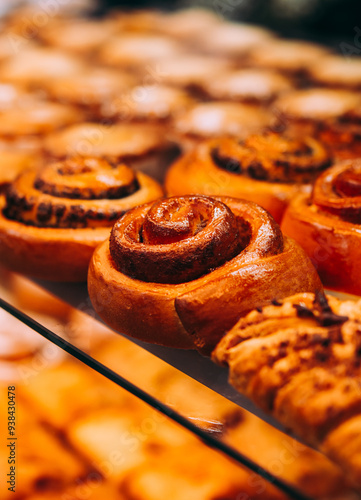 Obraz na płótnie Different kinds of fresh pastry, buns and cinnamon rolls on sale at a bakery or a cafe. w salonie