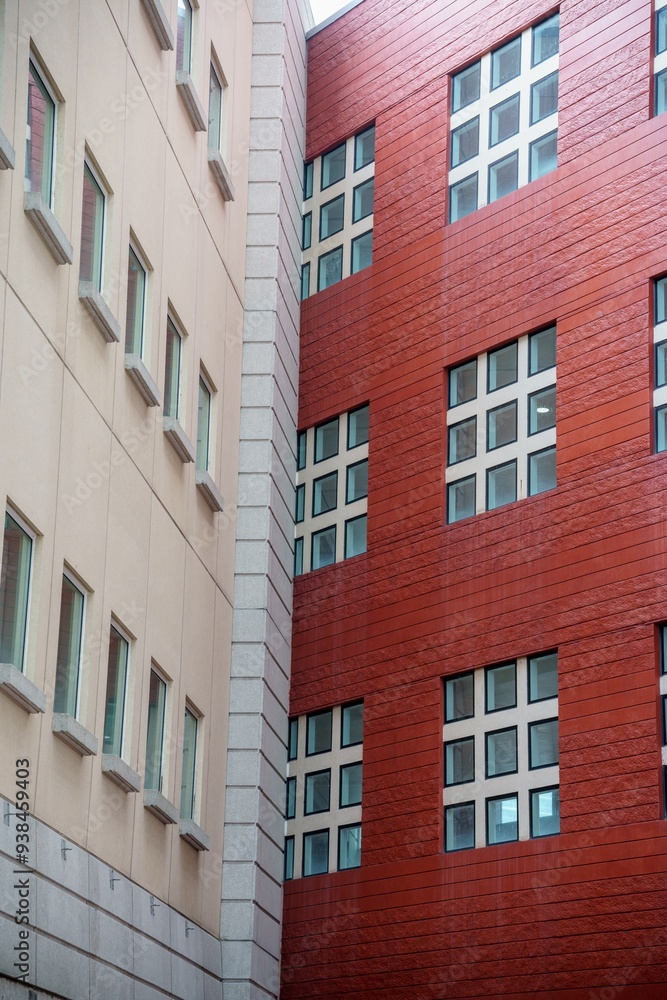 Fototapeta premium Vertical photo of two building walls joined at a corner