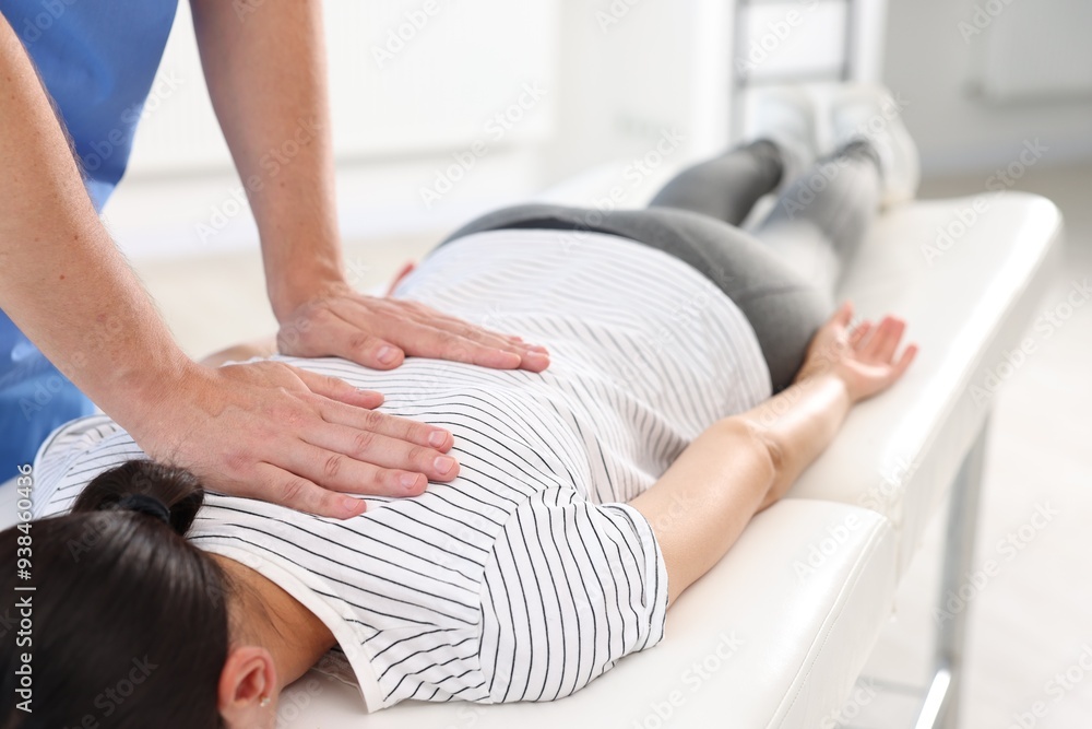 Physiotherapist working with patient in rehabilitation center, closeup Physiotherapist working with patient in rehabilitation center, closeup