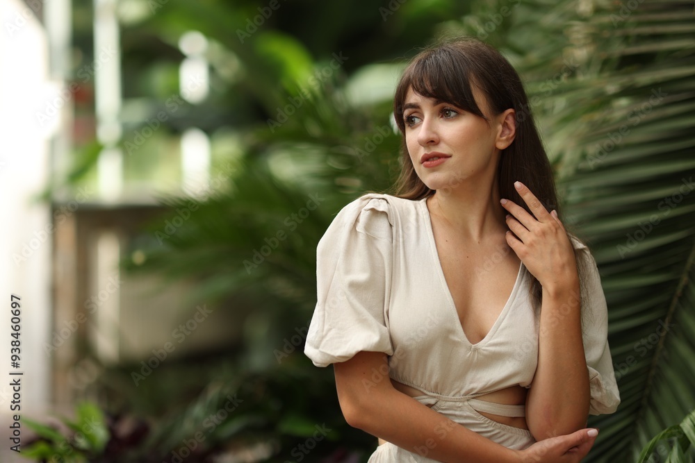 Portrait of beautiful woman in tropical forest. Space for text Portrait of beautiful woman in tropical forest. Space for text