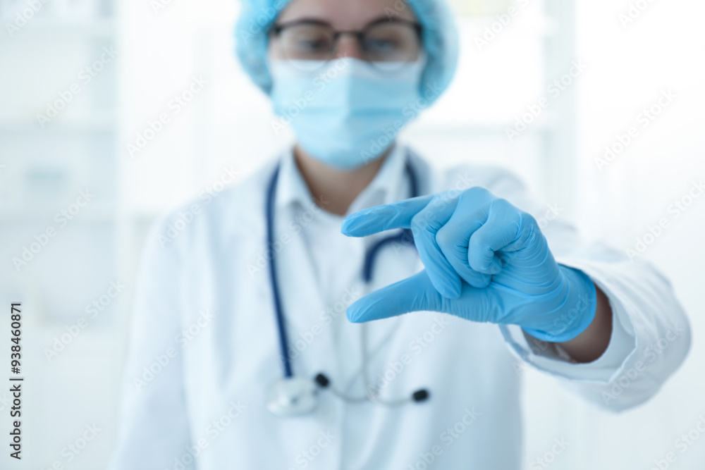 Doctor holding something in clinic, selective focus. Space for text Doctor holding something in clinic, selective focus. Space for text