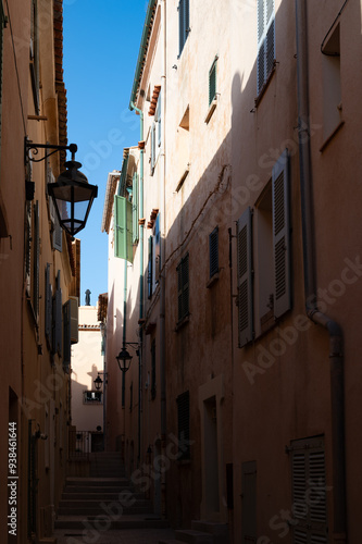 Walking in Saint-Tropez famous touristic village on French Riviera, summer vacation, colorful houses, Var, Provence, France