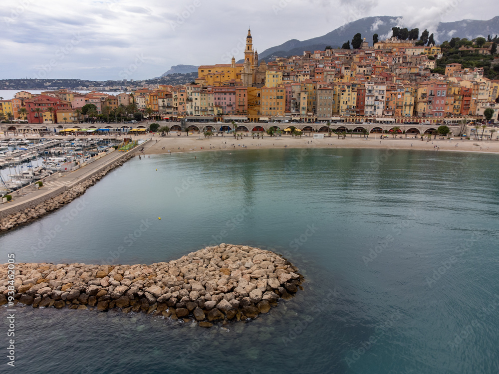 Obraz premium Aerial view on French Riviera, colorful Menton old city and marina on Mediterranean Sea near French-Italian border, travel destination, panoramic view from above