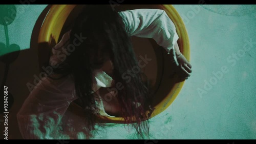 Possessed woman comes through a hole 